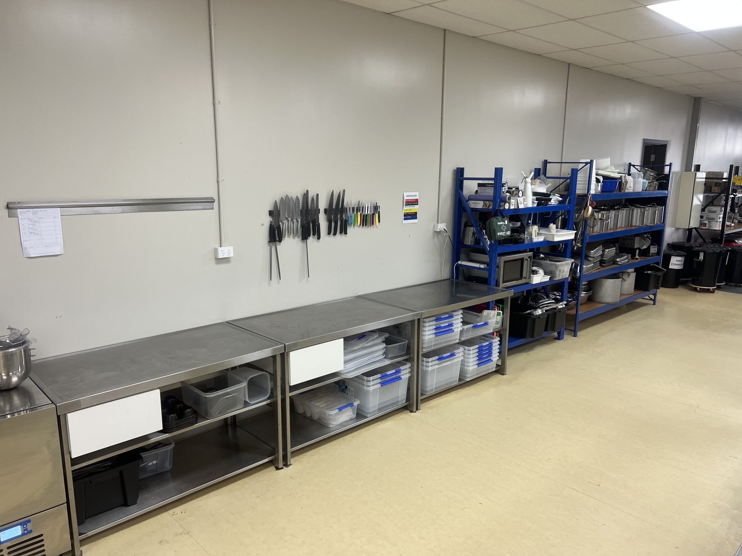 Stainless prep benches, knife station and storage shelving